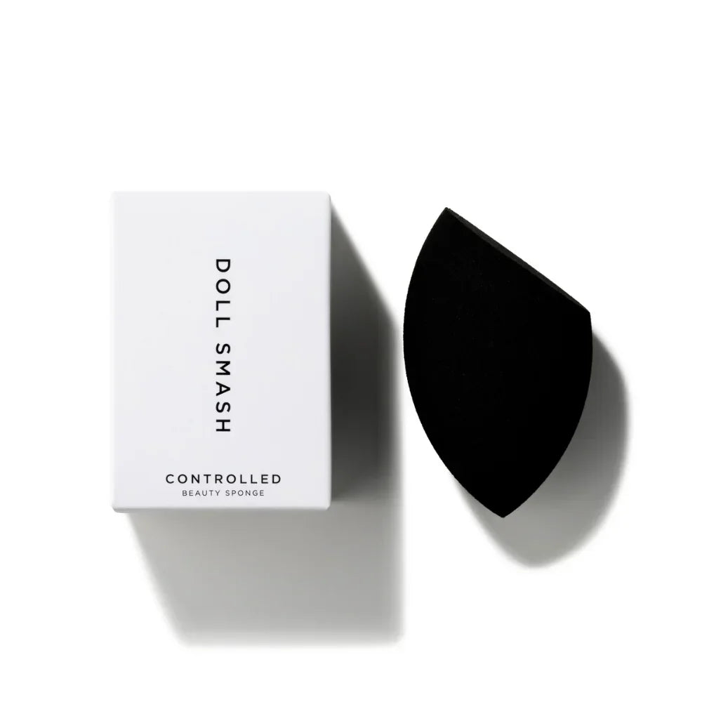 Doll Smash Controlled Beauty Sponge with sleek black applicator, minimalist white packaging