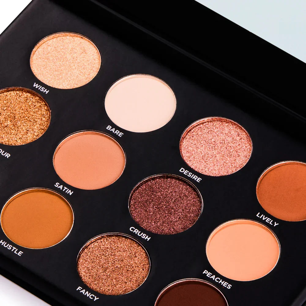 Luxury eyeshadow palette with shimmer and matte warm tones, perfect for everyday and evening makeup looks.