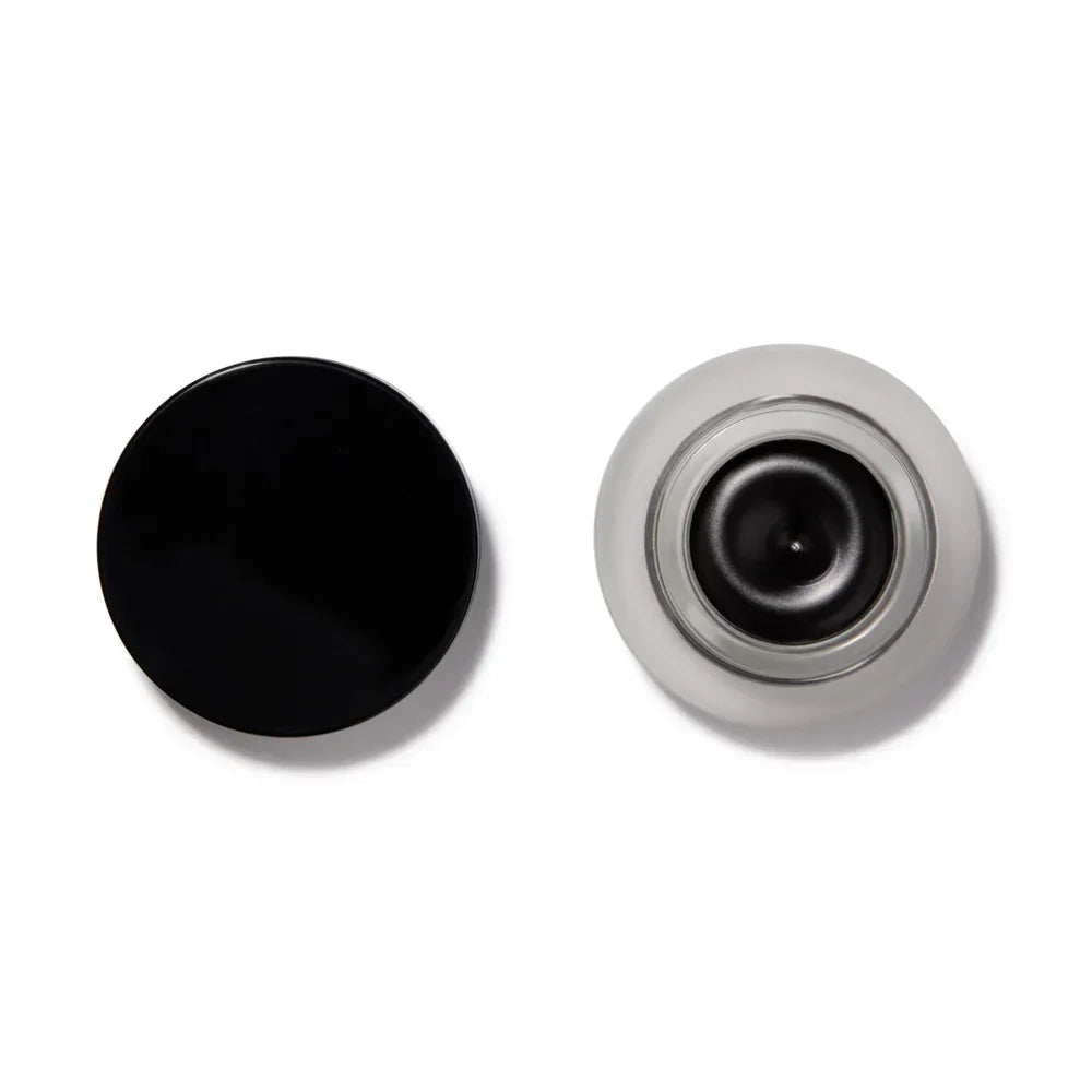 Luxury black eye cream in sleek silver jar with lid, British beauty skincare product