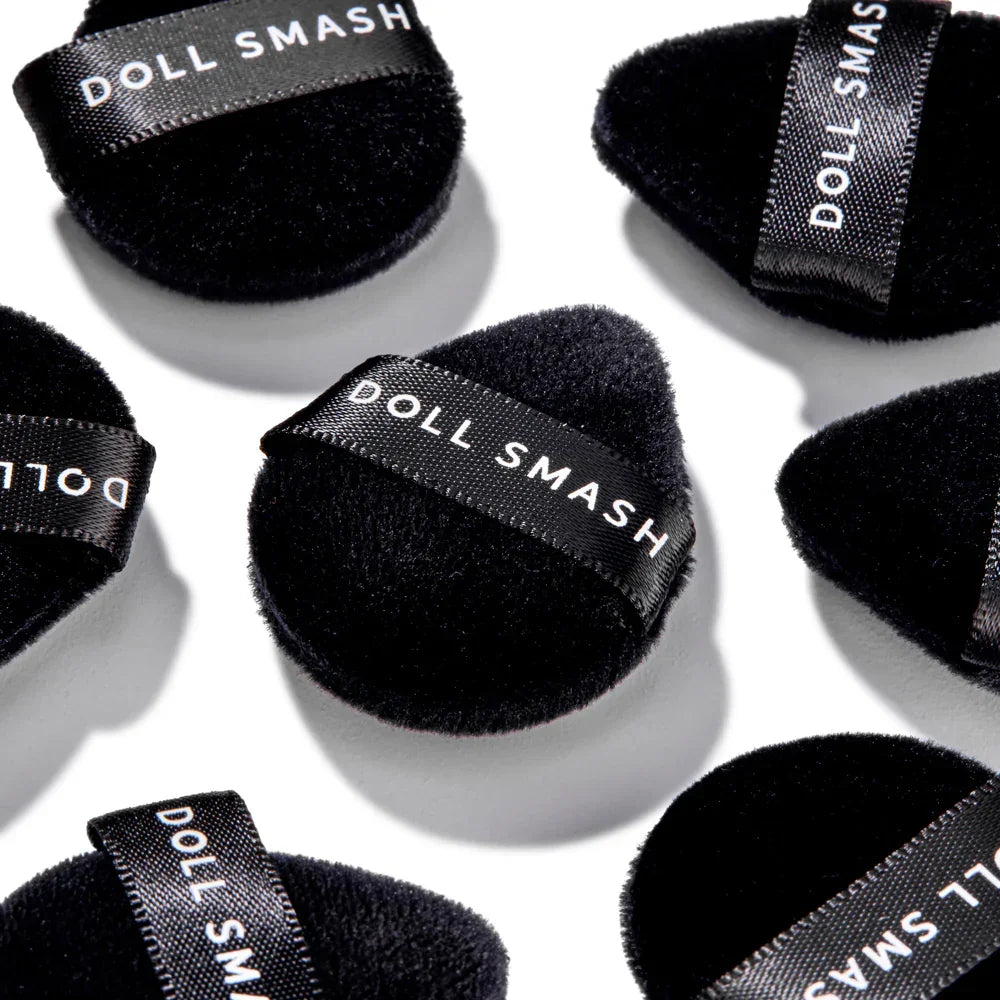Doll Smash black velvet makeup sponges with branded ribbon, ideal for flawless beauty application