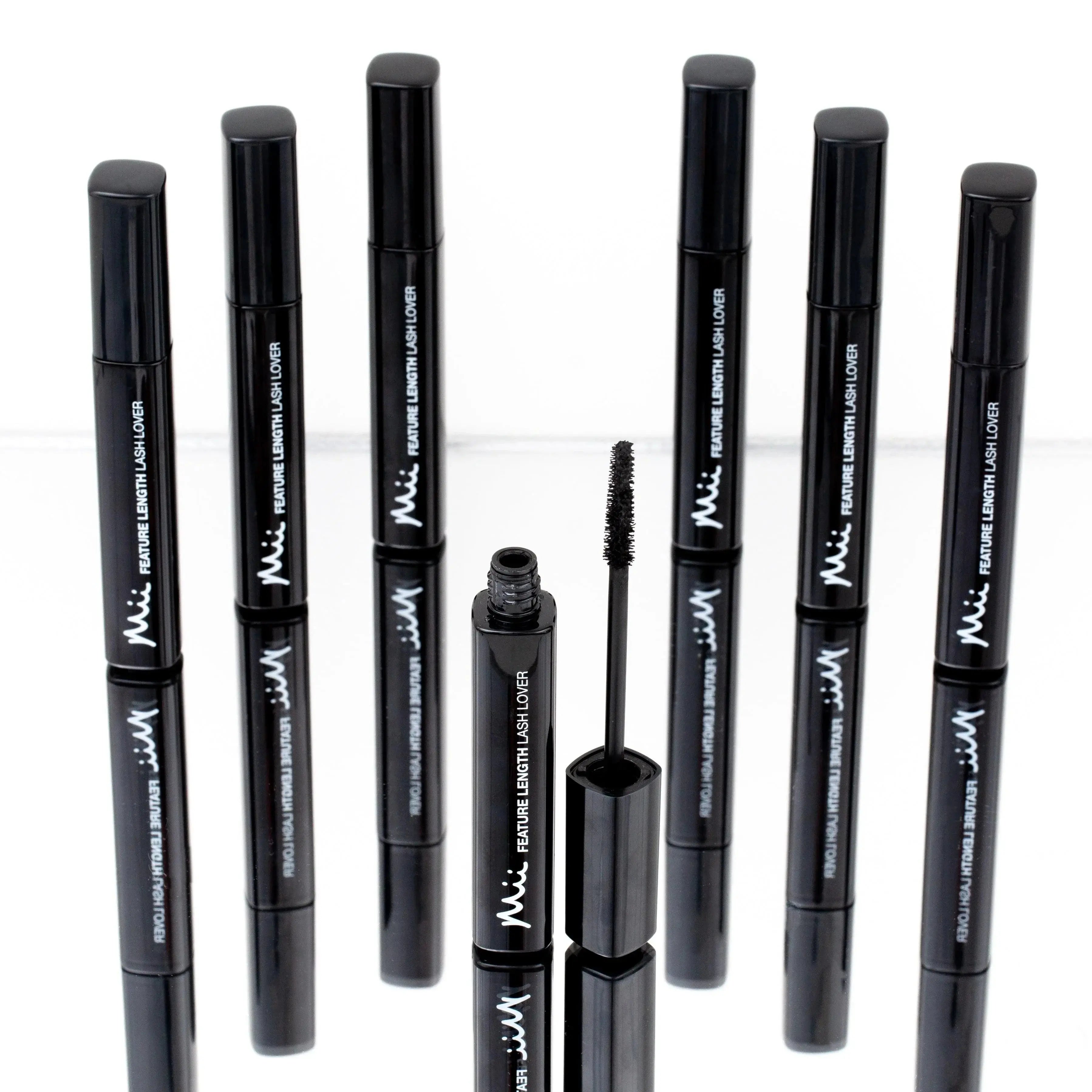 Mii Feature Length Lash Lover black mascara tubes with one open, showing the lash brush